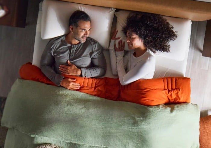 Couple is lying on the bad